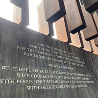 "For the hanged and beaten..." sign