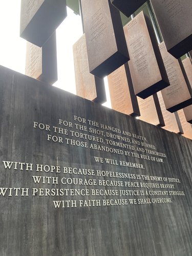 "For the hanged and beaten..." sign